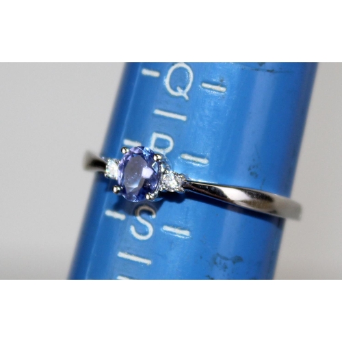 1270 - A 9ct white gold, diamond and Tanzanite ring in box - size R 1/2