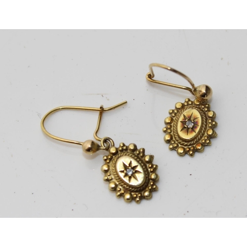 1273 - A pair of yellow metal and diamond drop earrings - tests as 18ct gold or higher but not marked