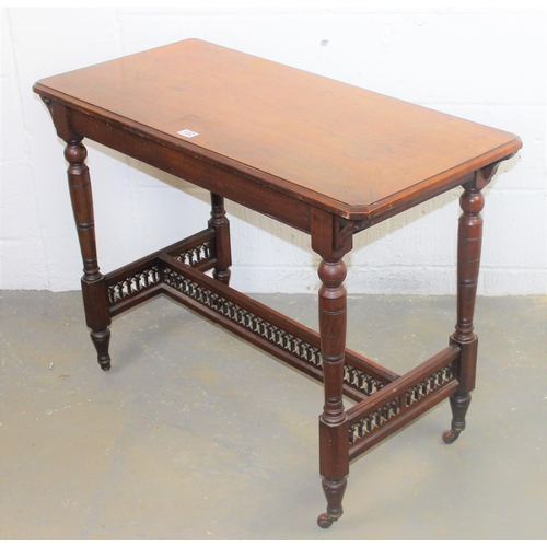 132 - A Victorian Gothic Revival library or hall table on brass and ceramic casters