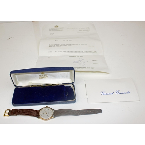 1437 - A 9ct gold cased gentleman's watch by Garrard - model 285W with original box and paperwork - 31.9g g... 