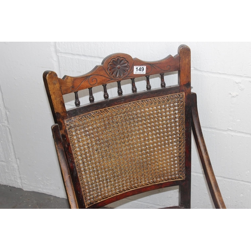 149 - An early 20th century bergere seated rocking chair