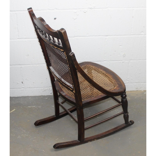 149 - An early 20th century bergere seated rocking chair