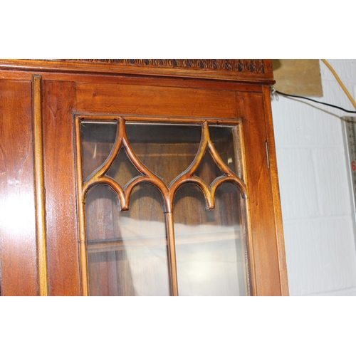 150 - A George III style astral glazed bureau bookcase with decorative fretwork swan-neck pediment