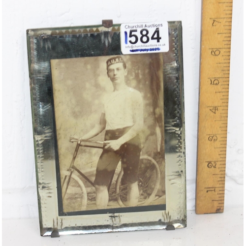 1584 - An antique photograph of a cycle club member in antique mirrored frame by Robinson of Dublin