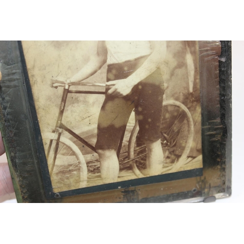 1584 - An antique photograph of a cycle club member in antique mirrored frame by Robinson of Dublin