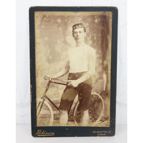 1584 - An antique photograph of a cycle club member in antique mirrored frame by Robinson of Dublin