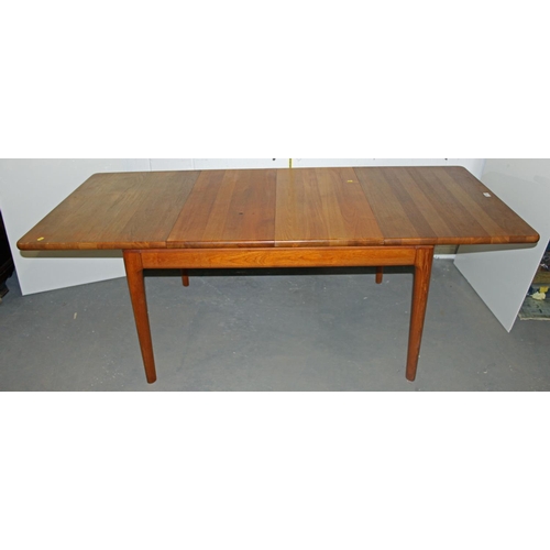 16 - A Danish made by Glostrup Teak extending dining table with 2 extra leaves and a set of 6 dining chai... 