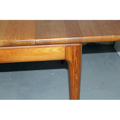 16 - A Danish made by Glostrup Teak extending dining table with 2 extra leaves and a set of 6 dining chai... 