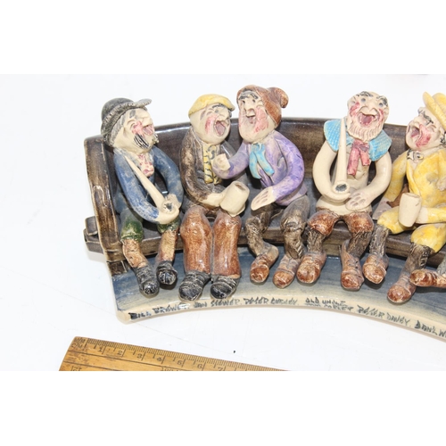 1688 - Will Young Devon pottery - Widdecombe Fair pottery group the figures seated on a long bench with the... 