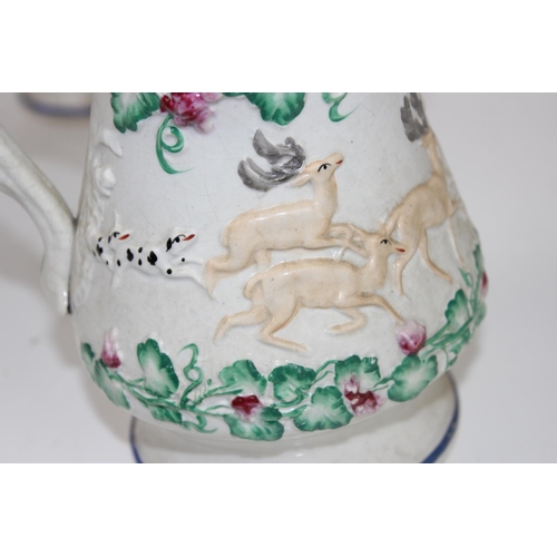 1825 - A set of 3 Victorian Prattware style relief moulded pottery jugs decorated with hunting scenes and B... 