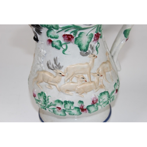 1825 - A set of 3 Victorian Prattware style relief moulded pottery jugs decorated with hunting scenes and B... 