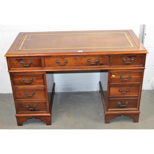 2 - A modern Yew wood leather topped pedestal desk