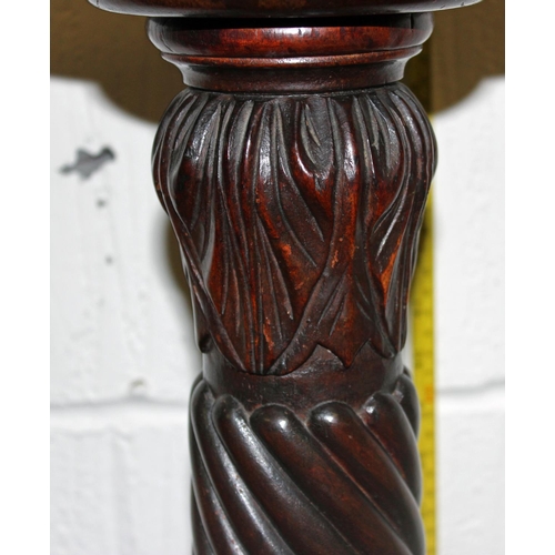 22 - A Victorian carved Mahogany pedestal standing on Ball & Claw feet