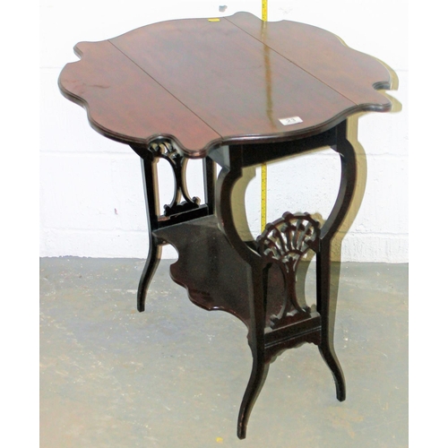 23 - An Art Nouveau period Mahogany drop leaf table with fretwork supports