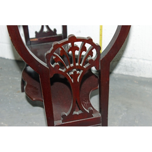 23 - An Art Nouveau period Mahogany drop leaf table with fretwork supports