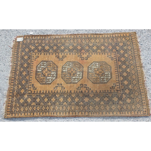 251 - A vintage orange ground triple medallion rug