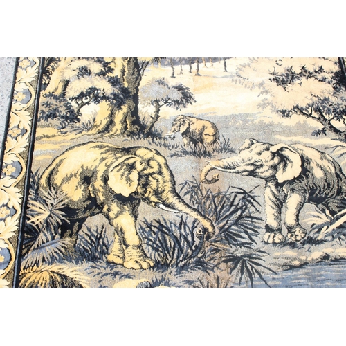 260 - A vintage tapestry rug decorated with elephants at a watering hole