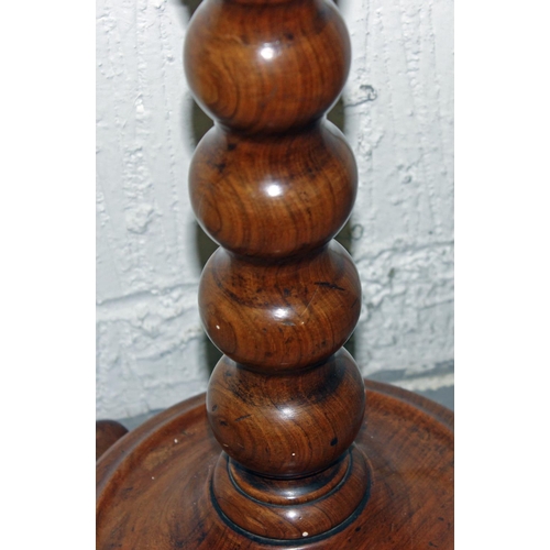 28 - An antique fruitwood lamp table or plant stand with bobbin turned support