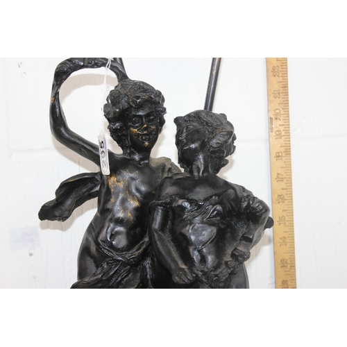 295 - An impressive bronze effect classical style lamp formed as 2 figures