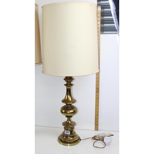 308 - An extremely large pair of turned brass lamps