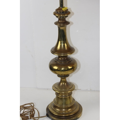 308 - An extremely large pair of turned brass lamps