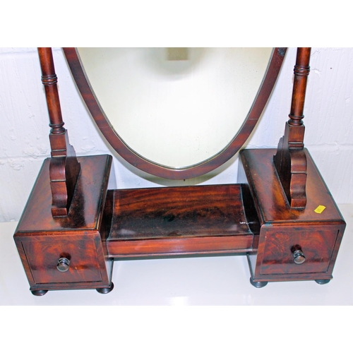 32 - An antique Mahogany shield shaped dressing table mirror with drawers