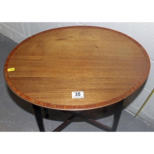 35 - An Edwardian oval lamp table