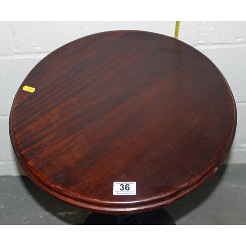 36 - A Victorian mahogany table standing on paw feet with twisted support