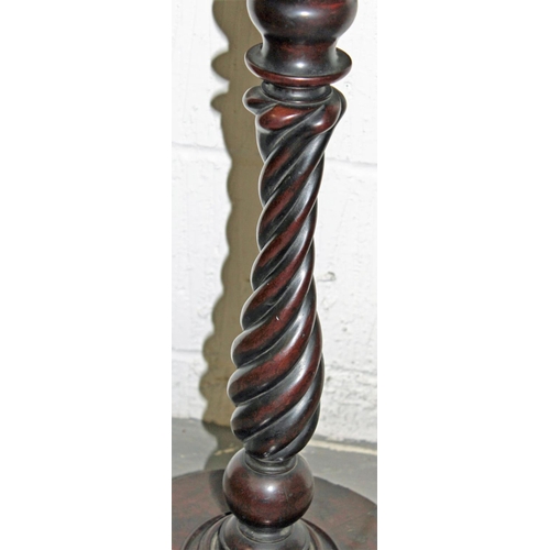 36 - A Victorian mahogany table standing on paw feet with twisted support