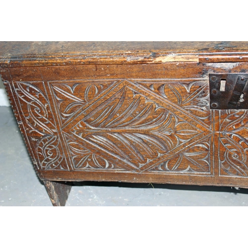 46 - A 17th/18th century small Oak coffer with carved details and iron fittings