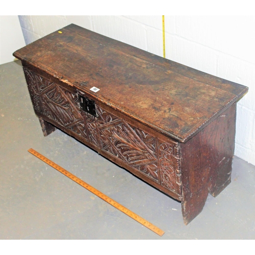 46 - A 17th/18th century small Oak coffer with carved details and iron fittings