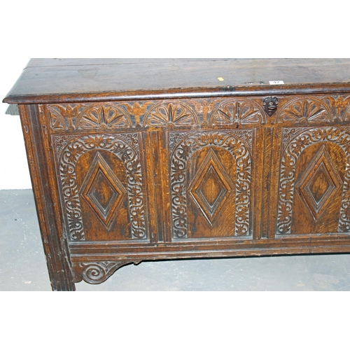 47 - A 17th/18th century larger Oak coffer with carved details and iron fittings