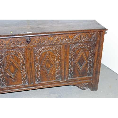 47 - A 17th/18th century larger Oak coffer with carved details and iron fittings