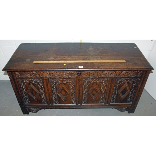 47 - A 17th/18th century larger Oak coffer with carved details and iron fittings