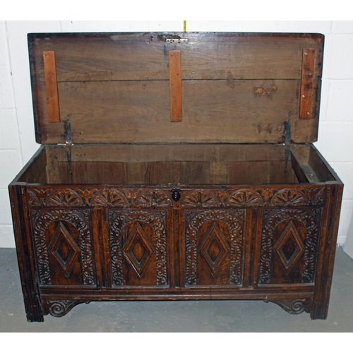 47 - A 17th/18th century larger Oak coffer with carved details and iron fittings