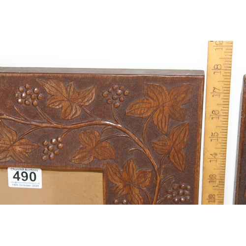 490 - A pair of Arts & Crafts period carved Oak frames decorated with fruiting vines