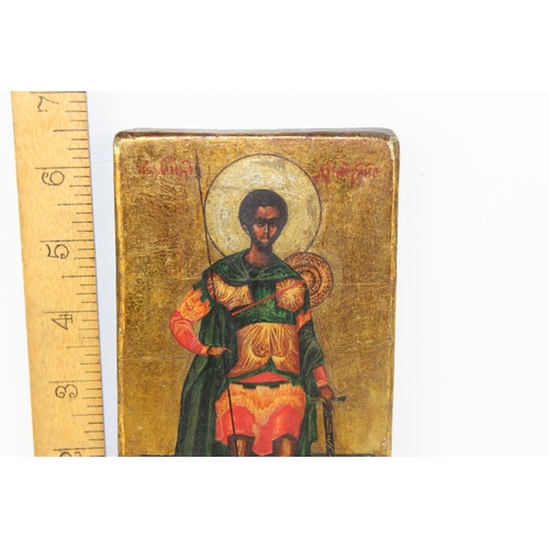 494 - An antique painted icon of a Saint with Sword and Spear believed to be Russian with pencil inscripti... 