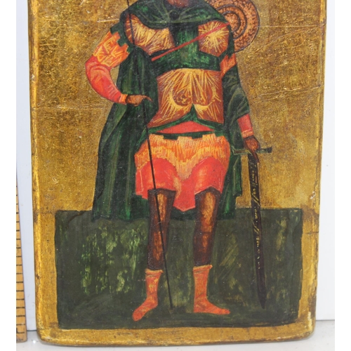 494 - An antique painted icon of a Saint with Sword and Spear believed to be Russian with pencil inscripti... 