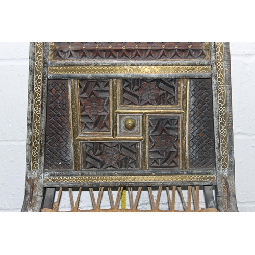 52 - An antique traditional Indian / Punjabi Pidha marriage chair of low form with carved and brass detai... 