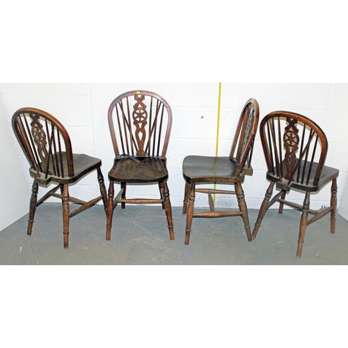 56 - A set of 4 early 20th century wheel back chairs with Elm seats