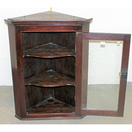 63 - A Georgian glazed Oak corner cabinet