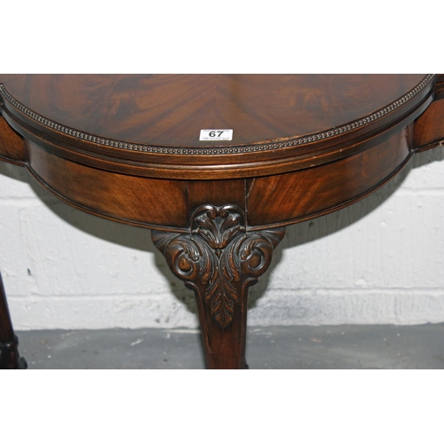 67 - A good quality fold over card table with baize interior standing on ball & claw feet