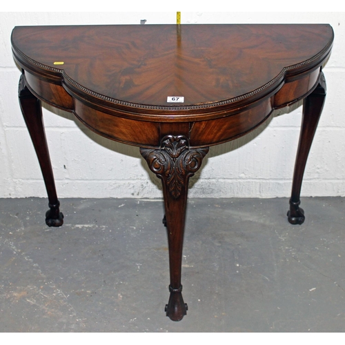 67 - A good quality fold over card table with baize interior standing on ball & claw feet