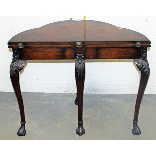 67 - A good quality fold over card table with baize interior standing on ball & claw feet