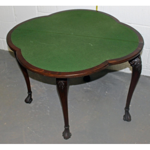 67 - A good quality fold over card table with baize interior standing on ball & claw feet