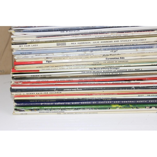 703 - A large qty of vinyl records to inc Queen