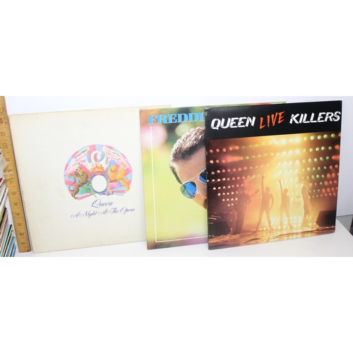 703 - A large qty of vinyl records to inc Queen