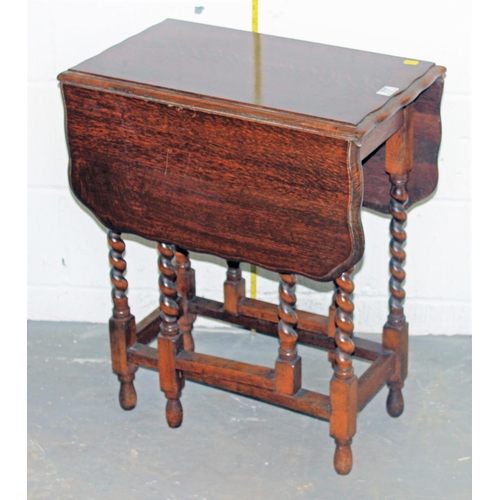 77 - A vintage drop leaf table with barley twist legs