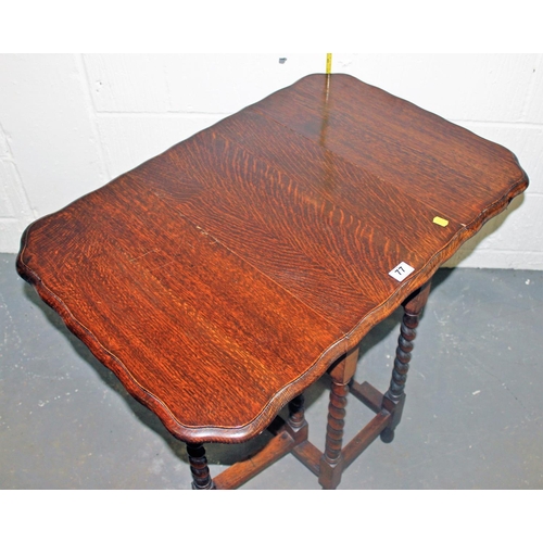 77 - A vintage drop leaf table with barley twist legs