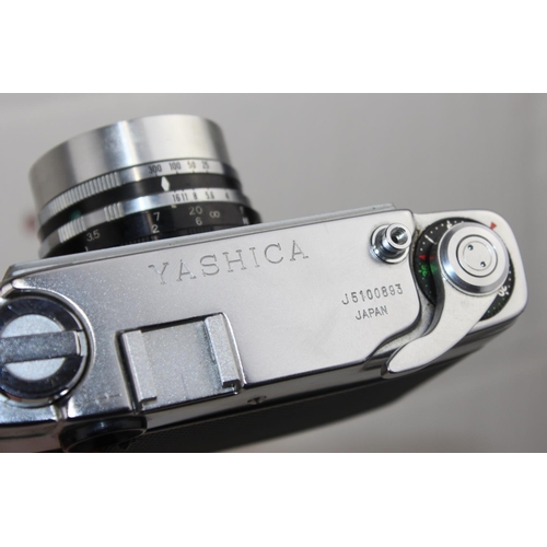 777 - A vintage Yashica J camera in case with Yashinon lens